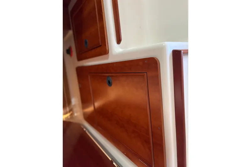 Slide: The Image of Interior wood paneling of 2003 PDQ 34 Power Catamaran, showcasing elegant craftsmanship. - 38