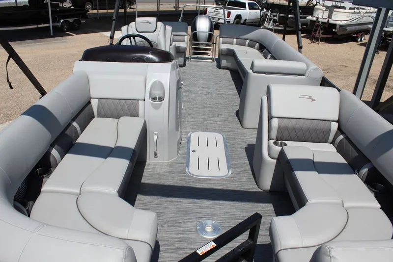 Slide: The Image of 2023 Bennington 23 LSR pontoon boat interior with luxurious seating and modern design. - 7