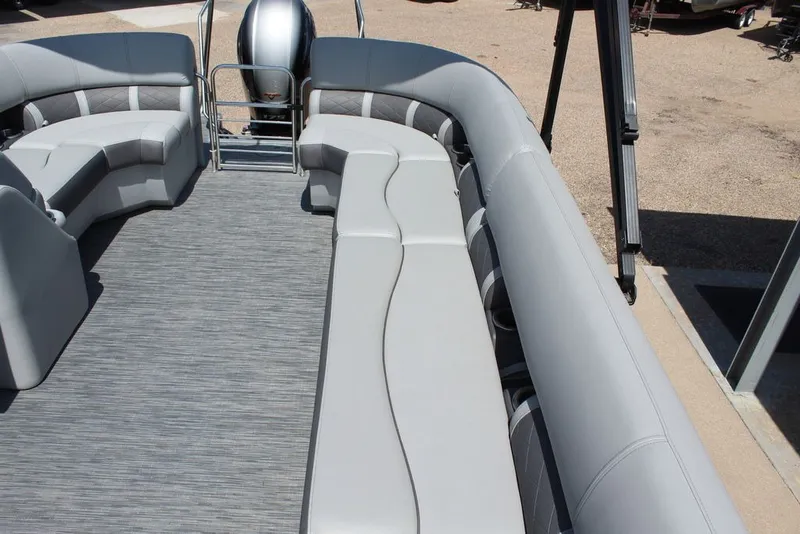 Slide: The Image of 2023 Bennington 23 LSR pontoon boat interior with gray seating and flooring. - 14