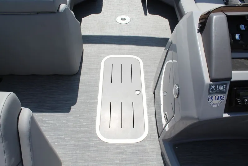Slide: The Image of Interior of 2023 Bennington 23 LSR boat, featuring sleek gray flooring and seating. - 22