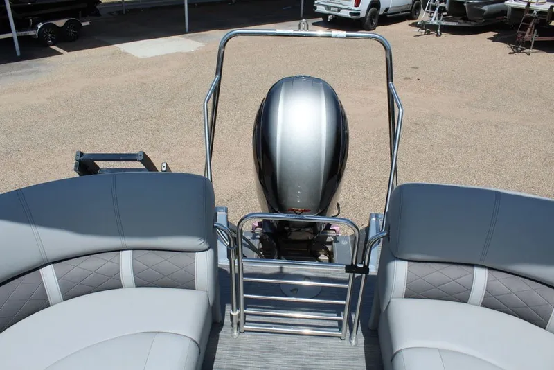 Slide: The Image of 2023 Bennington 23 LSR pontoon boat with sleek seating and powerful outboard motor. - 15