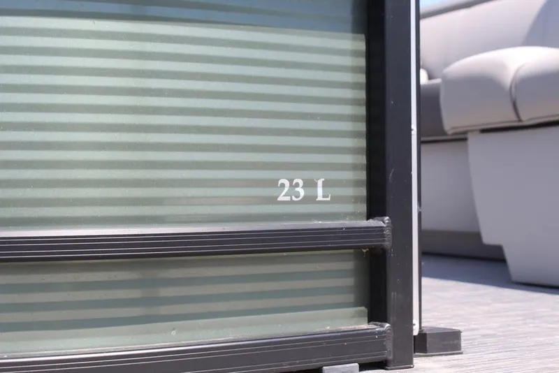 Slide: The Image of 2023 Bennington 23 LSR pontoon boat detail with seating and railing. - 23
