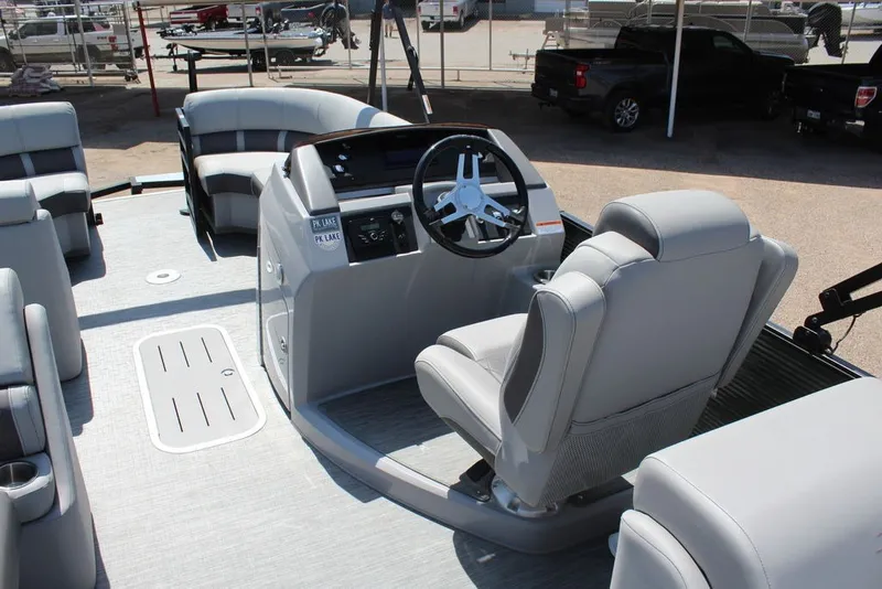 Slide: The Image of Interior view of 2023 Bennington 23 LSR pontoon boat with modern seating and steering console. - 13