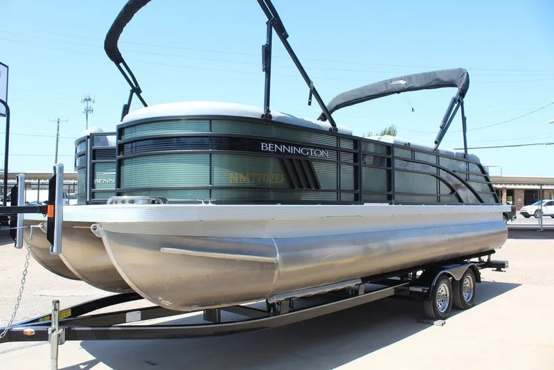 Slide: The Image of 2023 Bennington 23 LSR pontoon boat on trailer, featuring sleek design and modern amenities. - 16