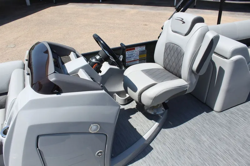 Slide: The Image of Captain's seat and helm of 2023 Bennington 23 LSR pontoon boat, featuring modern design. - 8