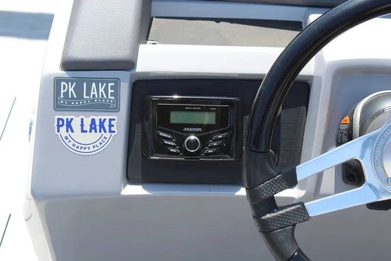 Slide: The Image of Dashboard of 2023 Bennington 23 LSR boat with PK Lake stickers and audio controls. - 20
