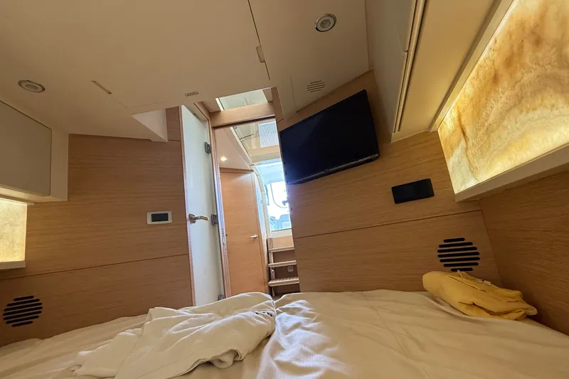 Slide: The Image of Interior cabin of 2021 Scout 530 LXF yacht, featuring modern design and cozy bedding. - 40