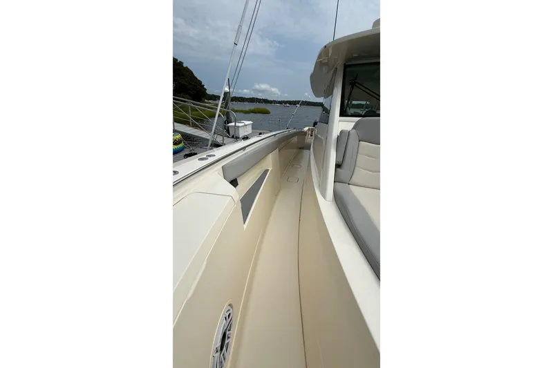Slide: The Image of 2021 Scout 530 LXF boat deck view, showcasing sleek design and comfortable seating. - 53