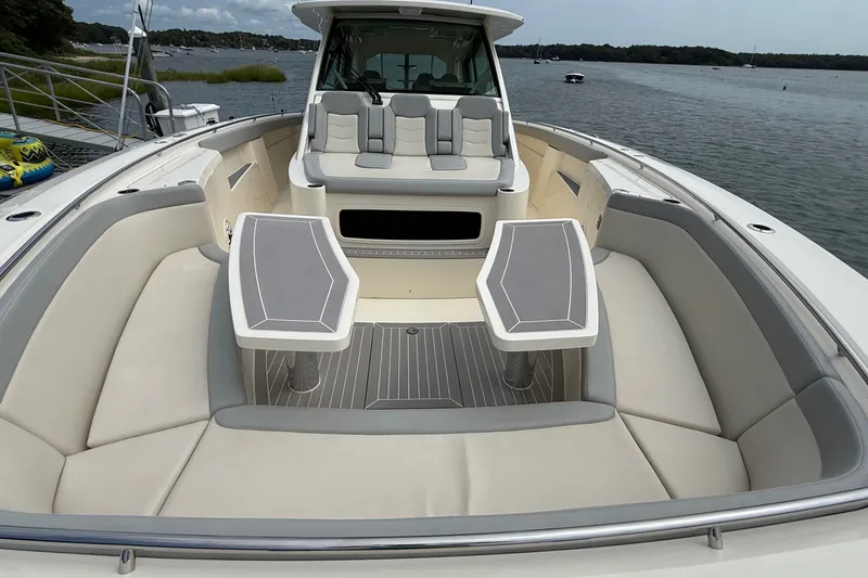 Slide: The Image of Luxurious 2021 Scout 530 LXF boat interior with spacious seating and elegant tables. - 47