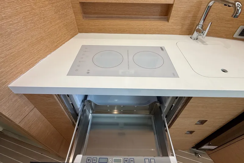 Slide: The Image of Modern kitchen area in 2021 Scout 530 LXF boat with stove and sink. - 34