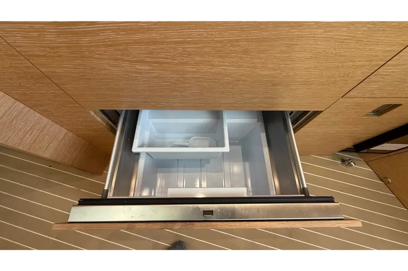 Slide: The Image of Open drawer refrigerator in 2021 Scout 530 LXF boat interior. - 35