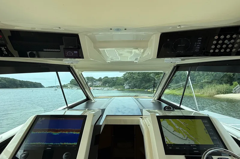 Slide: The Image of Interior view of 2021 Scout 530 LXF boat cockpit with navigation screens. - 24