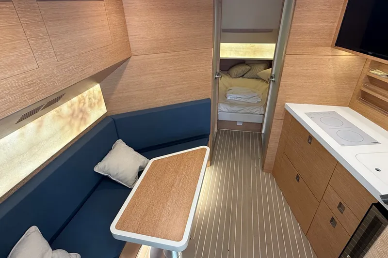 Slide: The Image of Luxurious interior of 2021 Scout 530 LXF yacht with modern seating and kitchenette. - 28