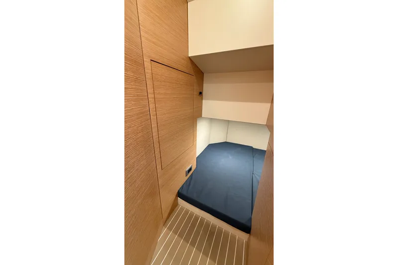 Slide: The Image of 2021 Scout 530 LXF cabin interior with wooden paneling and cozy sleeping area. - 41