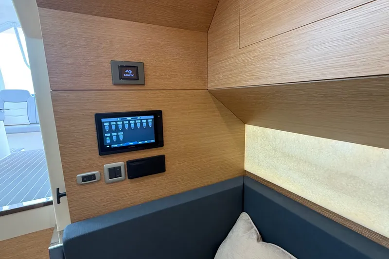 Slide: The Image of Interior of 2021 Scout 530 LXF yacht with control panel and seating area. - 31