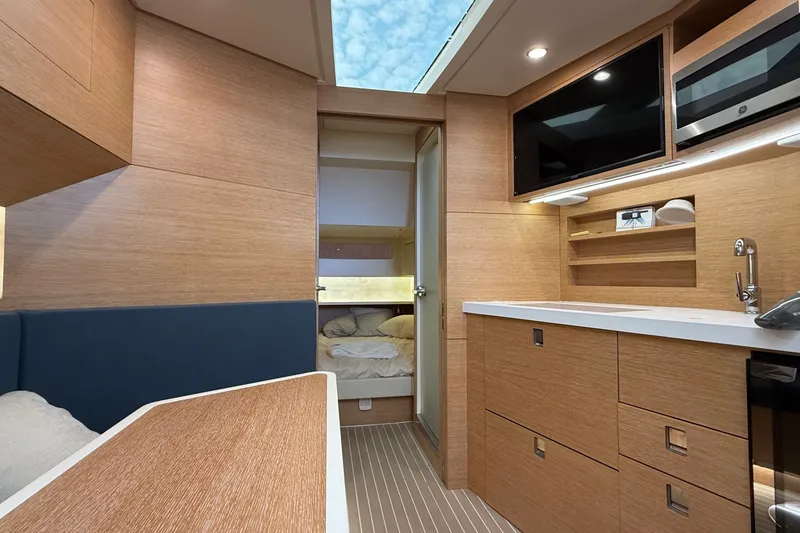 Slide: The Image of Luxurious interior of 2021 Scout 530 LXF yacht with modern kitchen and cozy sleeping area. - 33
