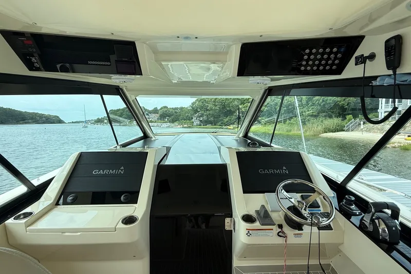 Slide: The Image of Interior view of 2021 Scout 530 LXF yacht cockpit with Garmin navigation displays. - 21
