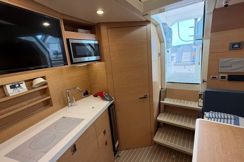 Slide: The Image of Luxurious interior of 2021 Scout 530 LXF yacht with modern kitchen and entertainment area. - 30