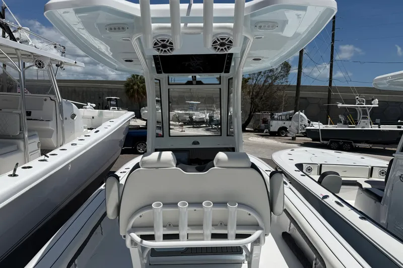 Slide: The Image of 2027 Tidewater 2500 Carolina Bay boat interior with seating and rod holders. - 3