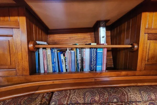 Slide: The Image of Bookshelf on 1979 Hans Christian 38 Traditional yacht with wooden interior. - 20