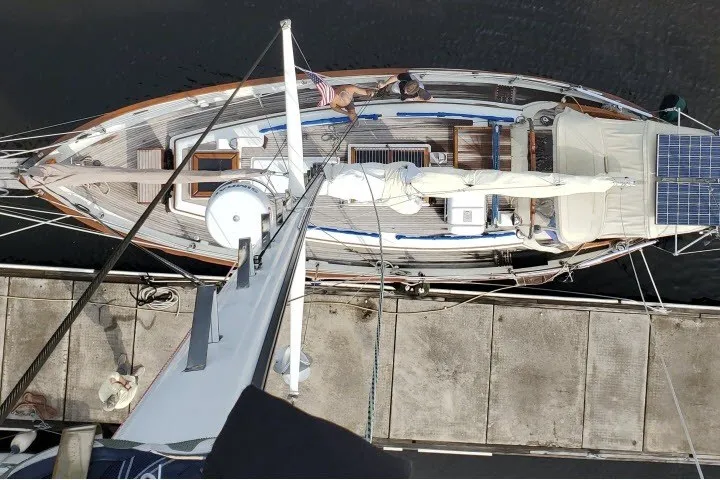 Slide: The Image of Aerial view of 1979 Hans Christian 38 Traditional sailboat docked, featuring solar panels and deck details. - 4