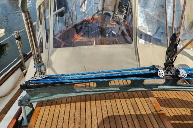 Slide: The Image of 1979 Hans Christian 38 Traditional sailboat deck with rigging and wooden finish. - 55