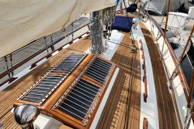 Slide: The Image of 1979 Hans Christian 38 Traditional sailboat deck with wooden finish and rigging details. - 51