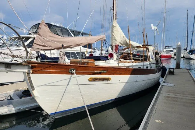 Slide: The Image of 1979 Hans Christian 38 Traditional sailboat docked at a marina, showcasing classic design. - 44
