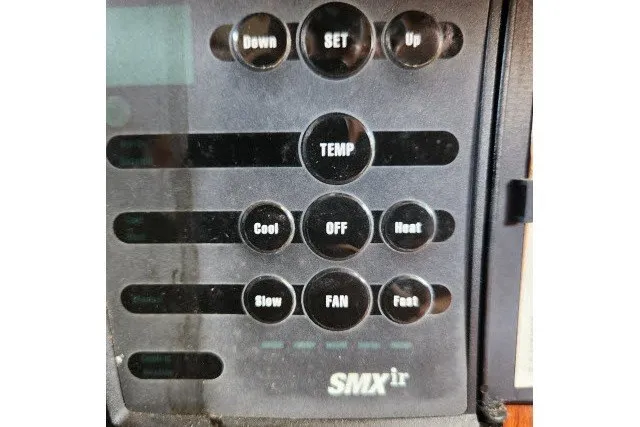 Slide: The Image of Control panel of a 1979 Hans Christian 38 Traditional boat, featuring temperature and fan settings. - 39