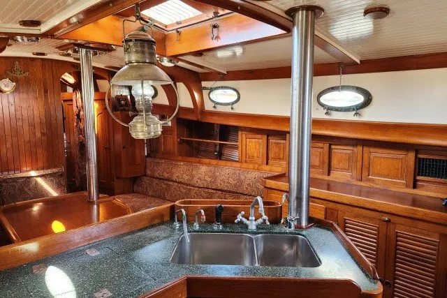 Slide: The Image of 1979 Hans Christian 38 Traditional yacht interior with wood finish and vintage lantern. - 18