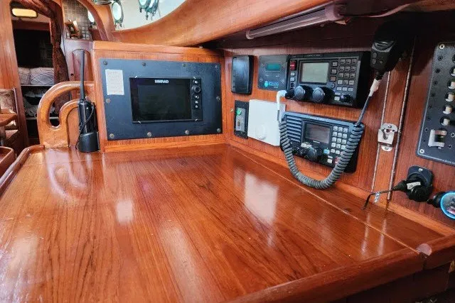 Slide: The Image of Navigation station on 1979 Hans Christian 38 Traditional sailboat with communication equipment. - 12