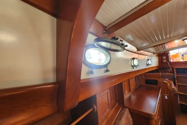 Slide: The Image of Interior of 1979 Hans Christian 38 Traditional sailboat with wooden finish and portholes. - 32