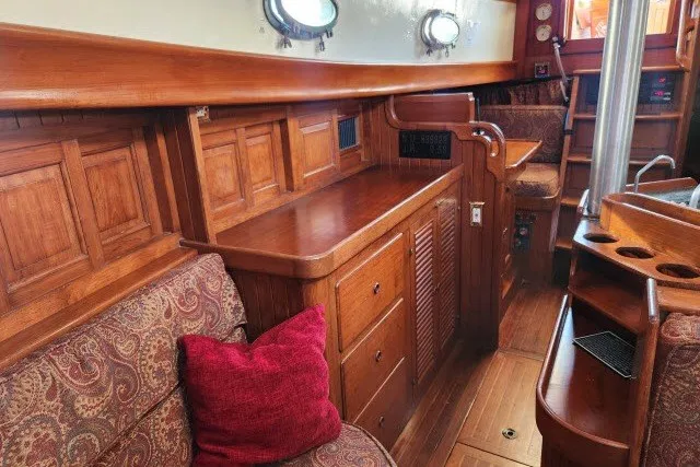 Slide: The Image of Interior of 1979 Hans Christian 38 Traditional sailboat with wooden cabinetry and seating. - 21