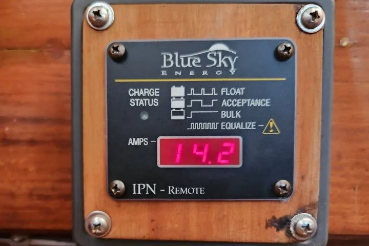 Slide: The Image of Blue Sky Energy charge controller displaying 14.2 amps on a 1979 Hans Christian 38 Traditional. - 38
