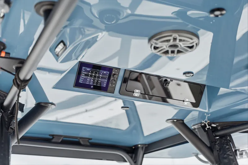 Slide: The Image of 2025 Yellowfin 42 Offshore boat interior with advanced control panel and speaker system. - 19