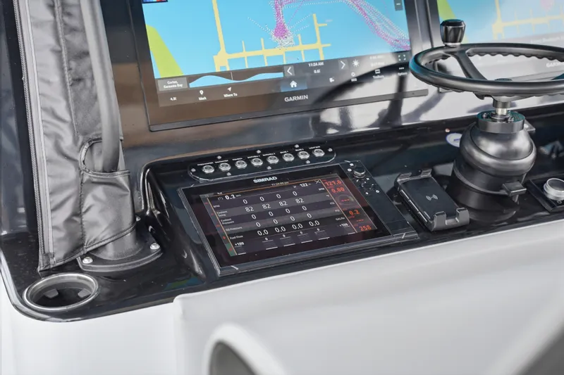 Slide: The Image of Dashboard of 2025 Yellowfin 42 Offshore boat with advanced navigation and control systems. - 62
