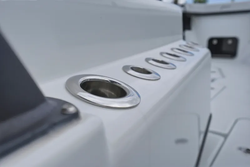 Slide: The Image of Close-up of rod holders on a 2025 Yellowfin 42 Offshore boat deck. - 22