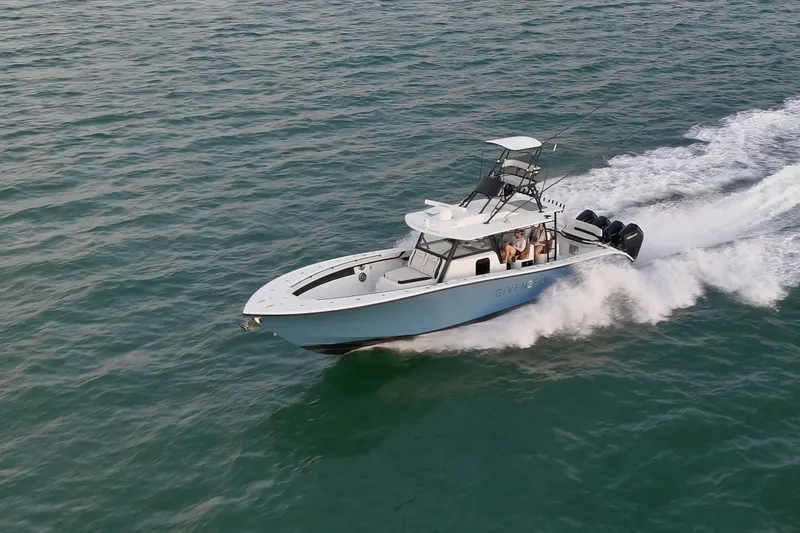 Slide: The Image of 2025 Yellowfin 42 Offshore boat cruising on open water. - 14