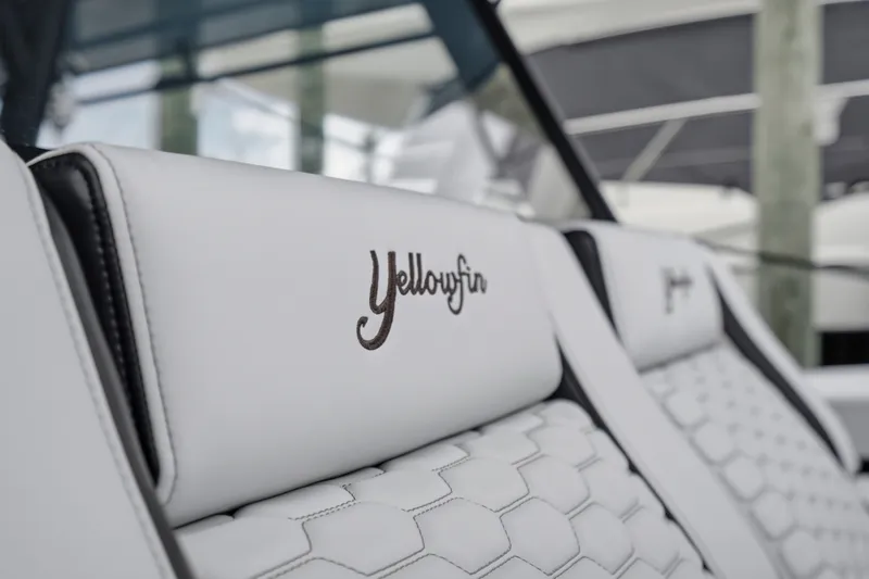 Slide: The Image of 2025 Yellowfin 42 Offshore boat seat with embroidered logo, showcasing luxury design. - 23