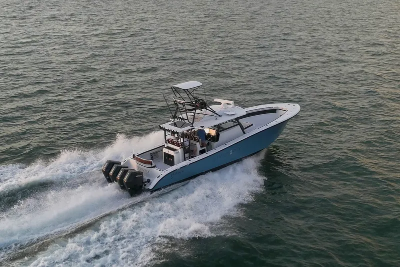 Slide: The Image of 2025 Yellowfin 42 Offshore boat cruising on open water. - 16