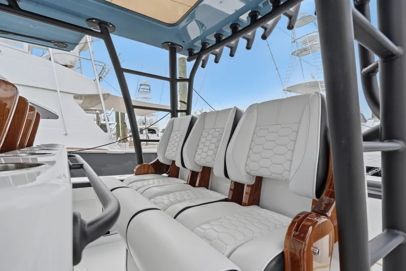Slide: The Image of Luxurious seating on the 2025 Yellowfin 42 Offshore boat, featuring elegant white upholstery. - 50