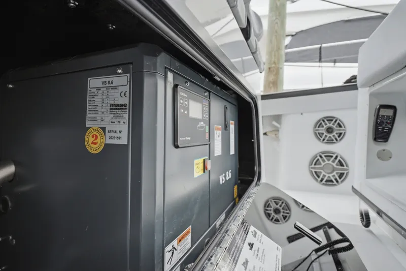 Slide: The Image of Interior view of 2025 Yellowfin 42 Offshore boat, showcasing electrical components and speakers. - 27
