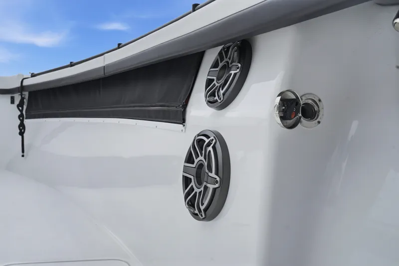 Slide: The Image of 2025 Yellowfin 42 Offshore boat speakers and deck detail against blue sky. - 21