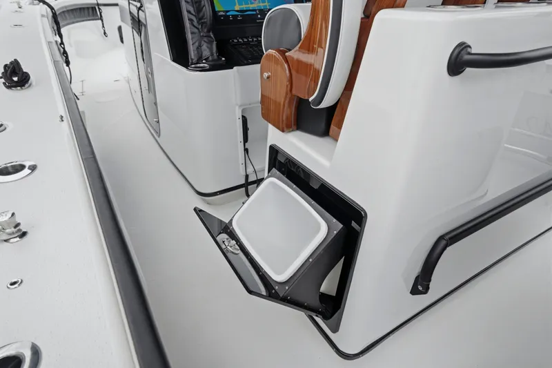 Slide: The Image of 2025 Yellowfin 42 Offshore boat interior with open storage compartment and seating. - 29