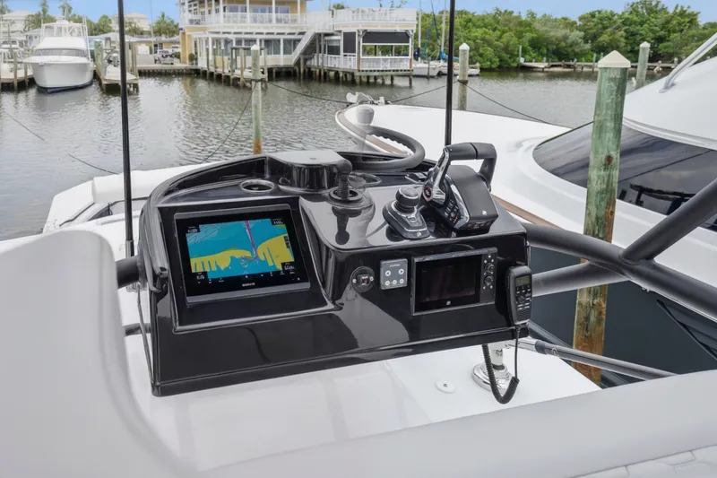 Slide: The Image of Helm of 2025 Yellowfin 42 Offshore boat with navigation equipment at marina. - 56