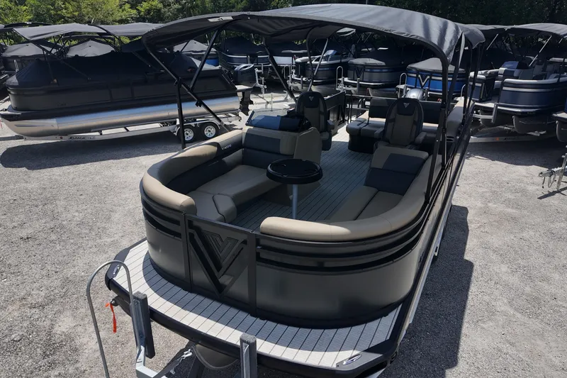 Slide: The Image of 2027 Viaggio V22S pontoon boat with canopy, parked on gravel lot. - 16