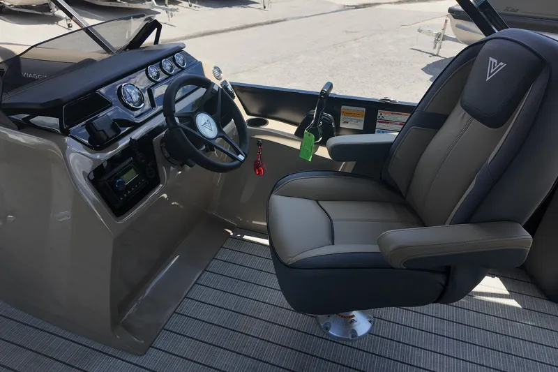 Slide: The Image of 2027 Viaggio V22S boat cockpit with steering wheel and luxurious captain's chair. - 11
