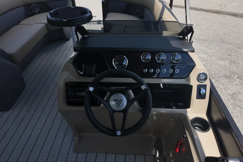 Slide: The Image of 2027 Viaggio V22S boat dashboard with steering wheel and control gauges. - 12