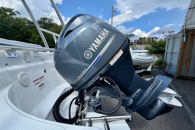 Slide: The Image of 2023 AB Inflatables Nautilus 14 DLX with Yamaha outboard motor, parked outdoors. - 17