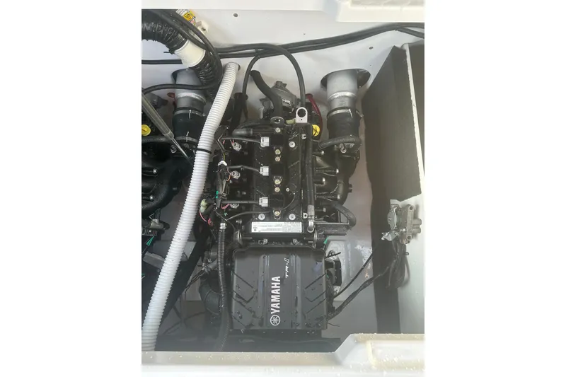 Slide: The Image of 2025 Yamaha Boats AR220 engine compartment showcasing advanced mechanical components. - 8